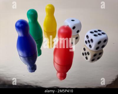 Board Game Pawns And Dice With Colored Pieces Stock Photo