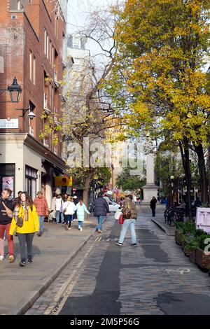 View of  shops and people shoppers walking on Monmouth Street near Seven Dials Covent Garden in London WC2 England UK   KATHY DEWITT Stock Photo