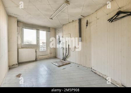 an empty room with no one on the floor or wall, but it's in need of repair work Stock Photo