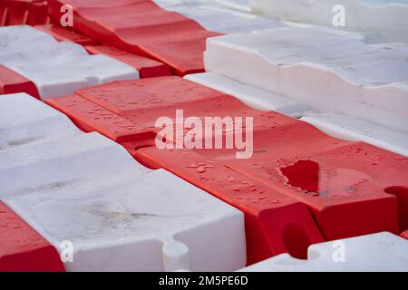 Road barriers for fencing place of repair of highway and preventing passage of cars into danger zone Stock Photo