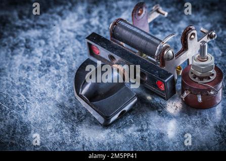 Electric resistor toggle switch on metallic background electricity concept. Stock Photo