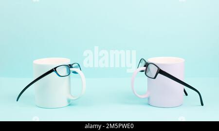 Cup or mug of coffee wearing eyeglasses, funny face, hot drink for breakfast, fathers day Stock Photo