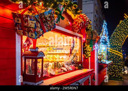 Craiova, Romania. Famous Christmas Market, european top 2022 winter destination in Eastern Europe, historical Oltenia. Wooden kiosk with Xmas decorati Stock Photo
