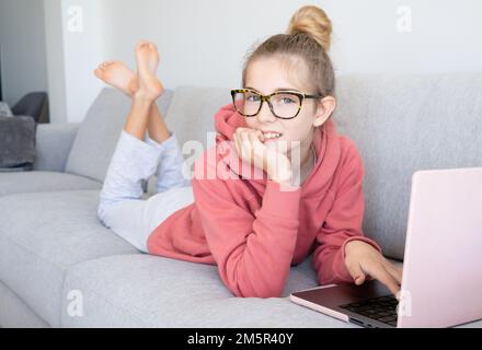 Student e-learning with a laptop at home Stock Photo