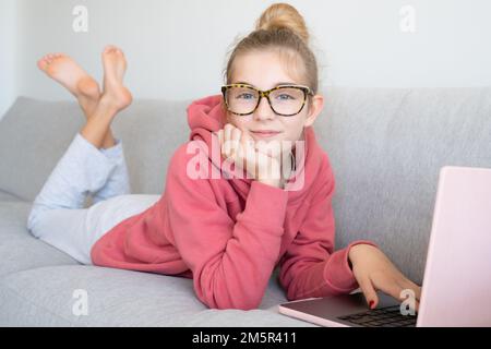 Student e-learning with a laptop at home Stock Photo