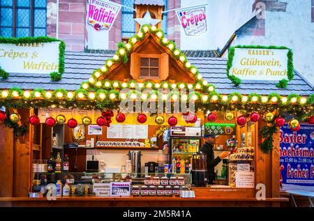 Basel, Switzerland - December 2017: Christmas fairytale market Weihnachtsmarkt Basel with  traditional mulled wine and crepes, Swiss Confederation. Stock Photo