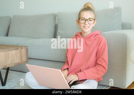 Student e-learning with a laptop at home Stock Photo