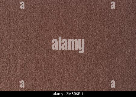 Brown color felt textile fabric material texture background. Abstract monochrome dark brown color background Stock Photo