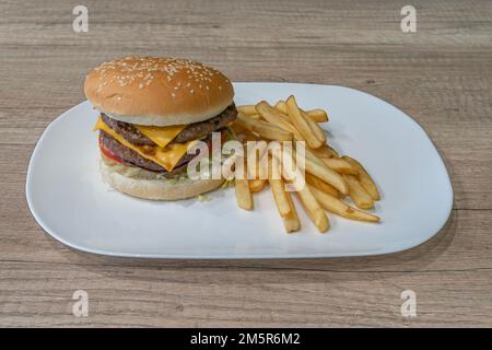 Middle East dishe culinary Still Life. Double Cheese burger with chopped steak and french fries Stock Photo