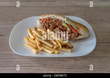 Middle East dishe culinary Still Life. Sandwich Kebab with french fries Stock Photo