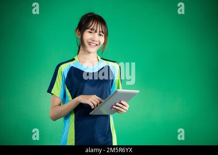 female ping pong athlete using digital tablet Stock Photo