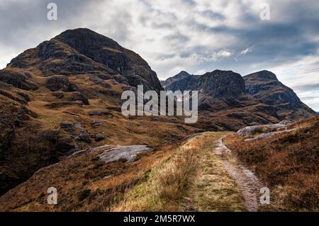 Landscape shot of the mountains known as the Three Sisters in Glencoe from the old military road on an autumn day Stock Photo