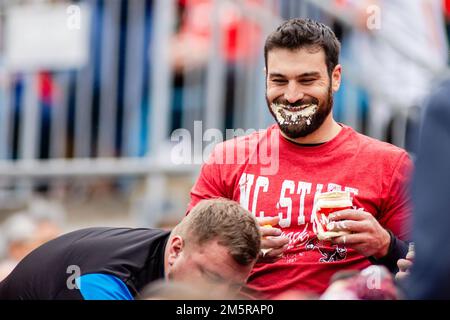 Charlotte, NC, USA. 30th Dec, 2022. North Carolina State Wolfpack fan covered in mayonnaise during the first half of the 2022 Duke's Mayo Bowl at Bank of America Stadium in Charlotte, NC. (Scott Kinser/CSM). Credit: csm/Alamy Live News Stock Photo