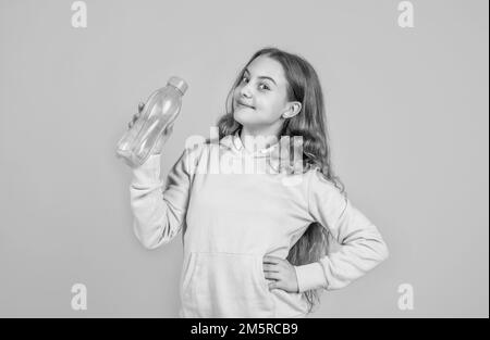 https://l450v.alamy.com/450v/2m5rcb9/just-one-sip-hydration-feel-thirsty-protein-and-vitamin-bottle-happy-and-healthy-teen-girl-fit-child-drink-water-after-training-sport-is-life-2m5rcb9.jpg