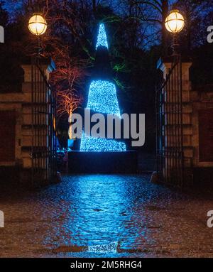 An ever-changing LED cone shaped Christmas tree at the stables at Waddesdon Manor, Buckinghamshire Stock Photo