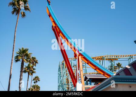 Low angle view of shockwave ride and palm trees at Santa Cruz Beach Boardwalk Stock Photo
