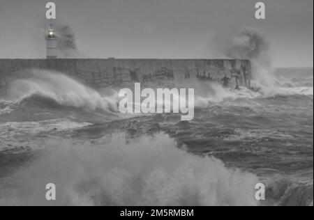 Newhaven, East Sussex, UK. 30th Dec, 2022. Blustery South Westerly wind whips up the waves at the end of another day on the Sussex coast. Further wild wet & windy weather is forecast but it remains relatively warm for the time of year. Credit: David Burr/Alamy Live News Stock Photo