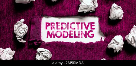 Handwriting text Predictive Modeling. Word for maintenance strategy driven by predictive analytics Stock Photo