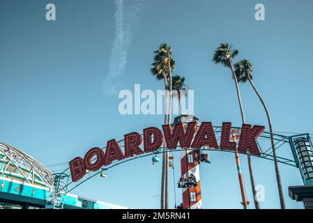 Red boardwalk text on entrance of amusement park at Santa Cruz Beach Boardwalk Stock Photo