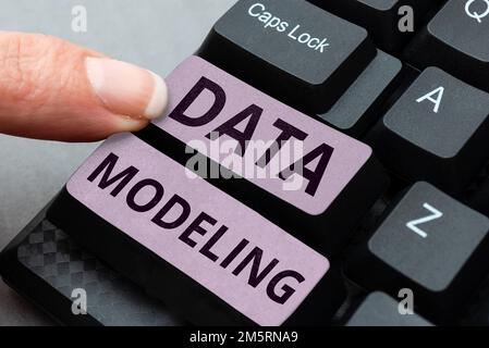 Text caption presenting Data Modeling. Concept meaning process of transferring data between data storage systems Stock Photo