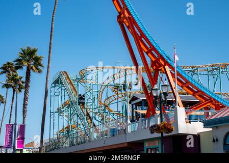 Various amusement park rides at Santa Cruz Beach Boardwalk during summer Stock Photo