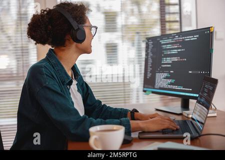 Freelancer female making new project as web designer and programmer on her computer at home office Stock Photo