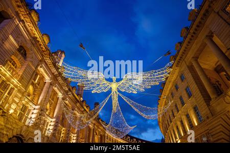 Architecture along Regent Street in London, UK. Evening view of Regent Street with Christmas lights above the road Stock Photo