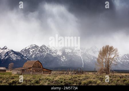 Lightning storm over Moulton Barn on Mormon Row in Grand Teton National Park, Wyoming Stock Photo