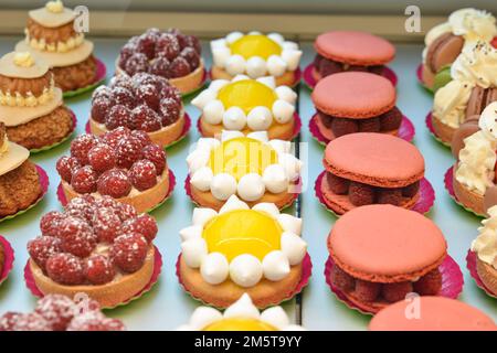 Different french cookies biscuit lemon macaroon raspberries Stock Photo