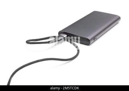 Fully charged portable powerbank with cable and two usb outputs isolated on a white background. Powerbank for charging mobile devices. Stock Photo