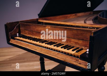 Old wooden piano keys on wooden musical instrument in front view. High quality photo Stock Photo