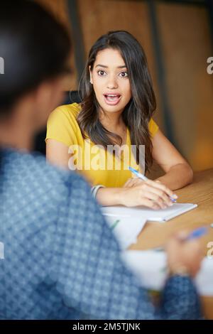 Take the risk or lose the chance. a businesswoman sitting in a meeting. Stock Photo