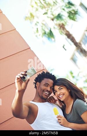 Memories made with love. a young couple taking a selfie together. Stock Photo