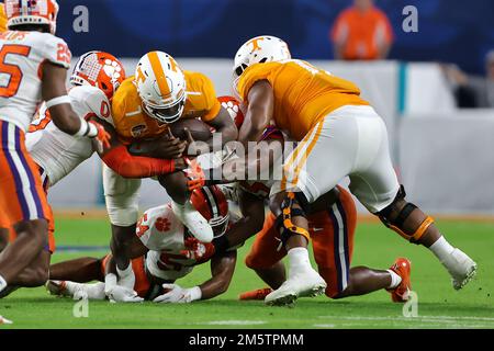 December 30, 2022: Tennessee Volunteers quarterback JOE MILTON III (7) runs the ball during the 2022 NCAA Capital One Orange Bowl game between the Tennessee Volunteers and the Clemson Tigers at Hard Rock Stadium in Miami Gardens, FL on December 30, 2022. (Credit Image: © Cory Knowlton/ZUMA Press Wire) Credit: ZUMA Press, Inc./Alamy Live News Stock Photo