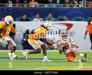 December 30, 2022: Clemson Tigers quarterback CADE KLUBNIK (2) runs the ball and slides for yardage during the 2022 NCAA Capital One Orange Bowl game between the Tennessee Volunteers and the Clemson Tigers at Hard Rock Stadium in Miami Gardens, FL on December 30, 2022. (Credit Image: © Cory Knowlton/ZUMA Press Wire) Credit: ZUMA Press, Inc./Alamy Live News Stock Photo