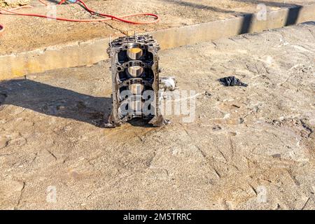 Cleaning dismantle four cylinder engine block Stock Photo