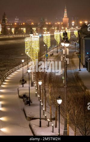 Moscow, Russia - December 27, 2022: Cold and deserted Moscow street on a snowy winter evening Stock Photo