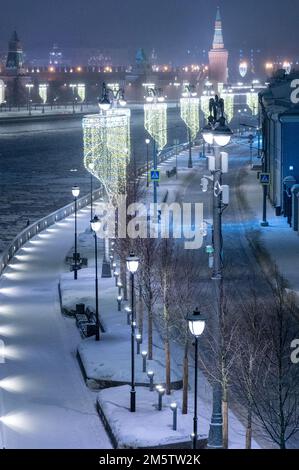 Moscow, Russia - December 27, 2022: Cold and deserted Moscow street on a snowy winter evening Stock Photo