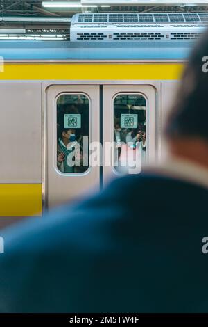 Commuters in a train station Stock Photo