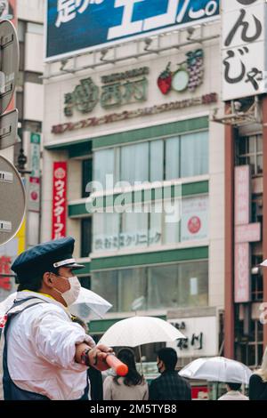 Traffic officer on duty in Shibuya, Tokyo Stock Photo