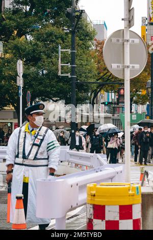 Traffic officer on duty in Shibuya, Tokyo Stock Photo