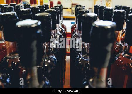 Bottlenecks and caps of Armagnac alcohol (a french grape brandy) in the South of France (Gers) Stock Photo