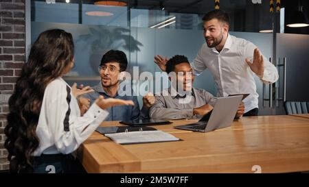 Businesswoman explain idea to worker business conflict quarrel misunderstanding with partners. Multiracial coworkers with laptop arguing in office Stock Photo