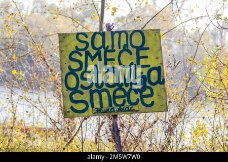 Wooden warning sign, at the entrance to the forest. Stock Photo