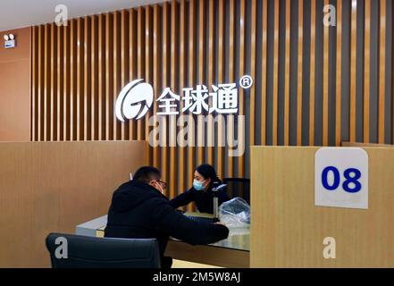 SUQIAN, CHINA - DECEMBER 31, 2022 - Citizens handle 5G services at the business hall of China Mobile in Suqian, Jiangsu province, China, Dec 31, 2022. Stock Photo