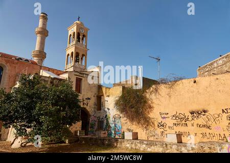 Venetian old town, church, steeple, minaret, wall, graffiti, blue cloudless sky, Chania, West Crete, island of Crete, Greece Stock Photo