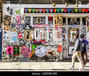 Colourful collection of street art on the disused Seven Stars Public House on Brick Lane in London's Shoreditch, 2022. Stock Photo