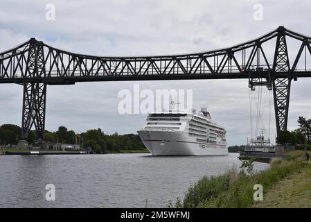 Cruise ship Europa 2 under the Rendsburg High Bridge in the Kiel Canal, Germany Stock Photo