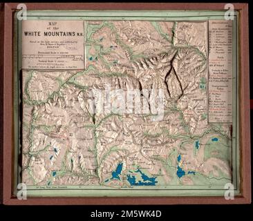 Map of the White Mountains, N.H : based on the best surveys. Raised relief model. Relief also shown by spot heights. Includes list of points of interest with elevations. Travel information on cover.. Three-dimensional relief maps are visual aids that assist schoolchildren in understanding physical terrain. The first relief maps were created in China, and appeared in Europe in the late 18th century. This late 19th century map of the White Mountains, published in Boston, allows the viewer to grasp the mountainous terrain of northern New Hampshire.. Relief map of the White Mountains. Relief map o Stock Photo