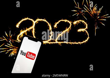 In this photo illustration a Youtube logo seen displayed on a smartphone. Stock Photo